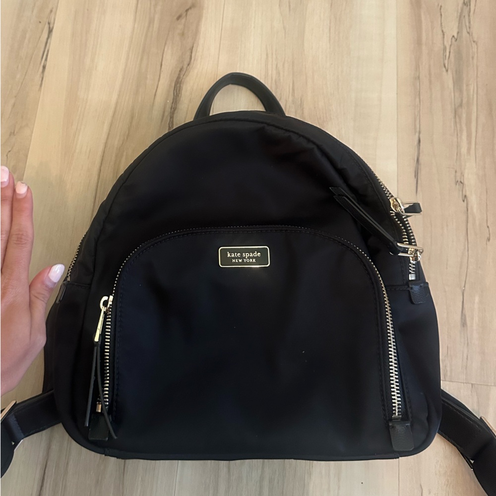 Kate Spade Black and Gold Backpack with Structured Design